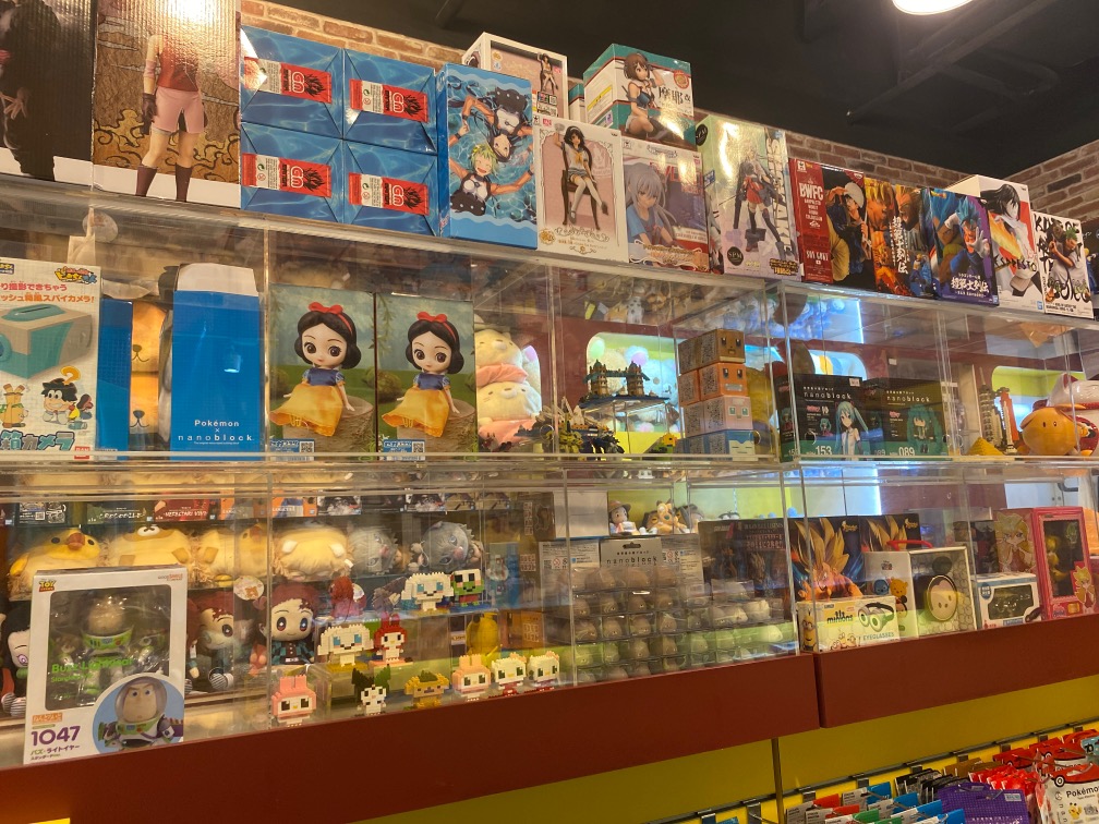 Shelves filled with a wide array of anime figures, nanoblocks, and character merchandise at Otaku House.