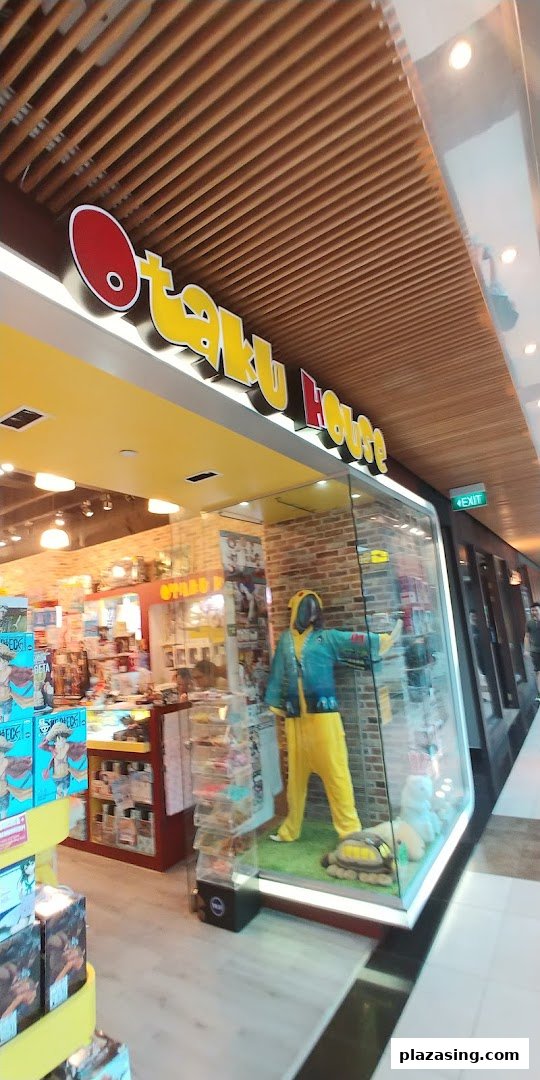 The storefront of Otaku House featuring a display window with a character costume.