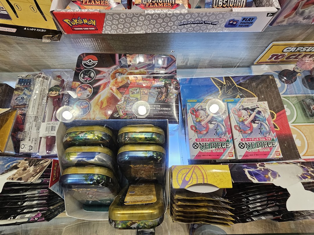 A vibrant display of Pokémon and One Piece trading card game products and anime merchandise.