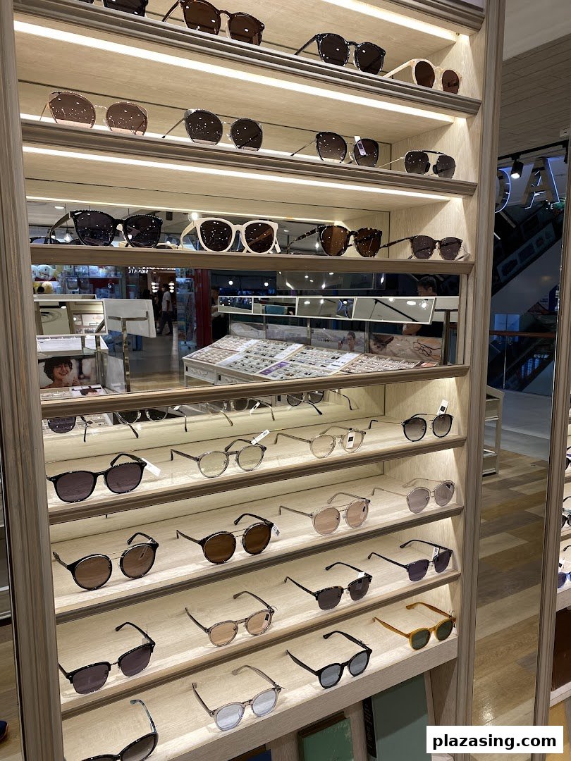 A well-lit display shelf showcasing a wide variety of stylish eyeglasses and sunglasses at OWNDAYS.
