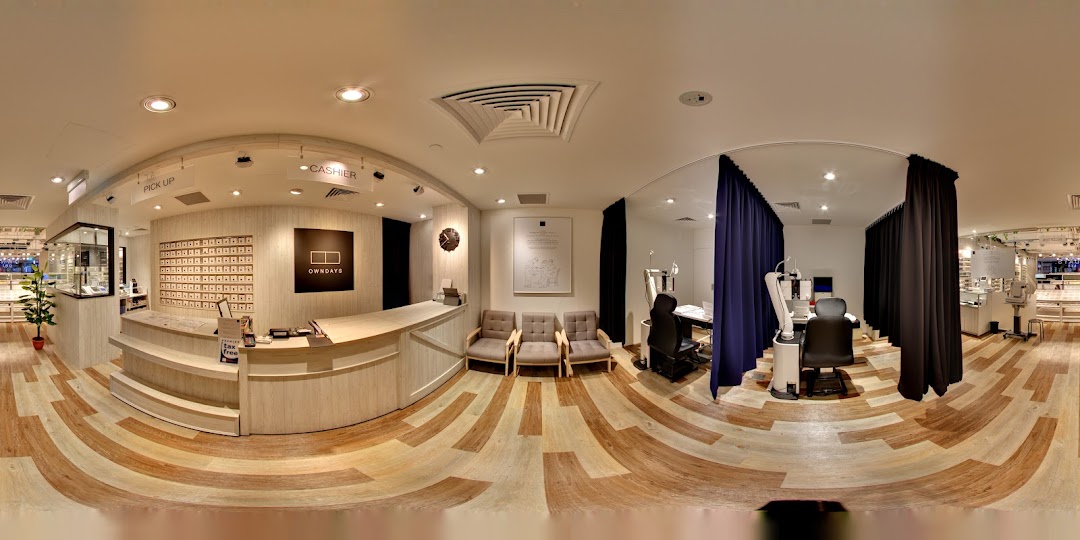 A panoramic view of the modern and well-equipped interior of OWNDAYS optical shop.