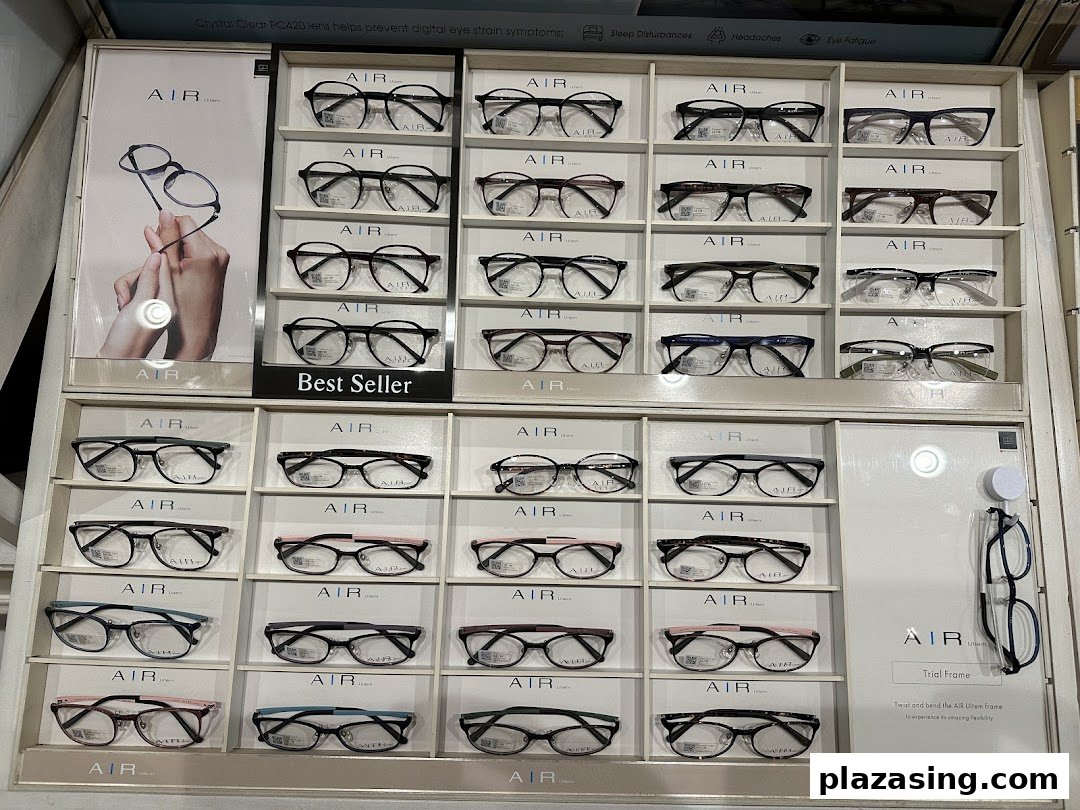 A retail display wall showcasing a wide selection of 'AIR' brand eyeglasses, including 'Best Seller' models.