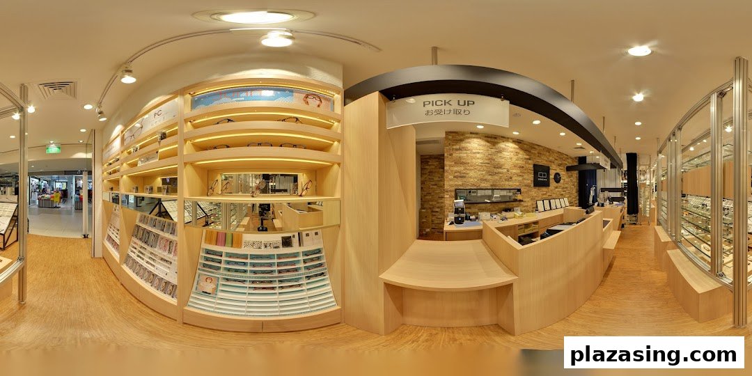 A panoramic view of OWNDAYS eyewear store interior, showcasing display shelves, a pick-up counter, and various glasses.