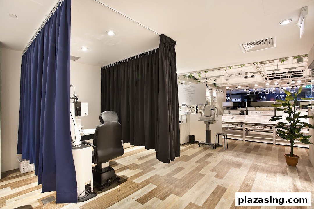 Interior view of OWNDAYS, featuring a private eye examination area and a glimpse of the eyewear display.