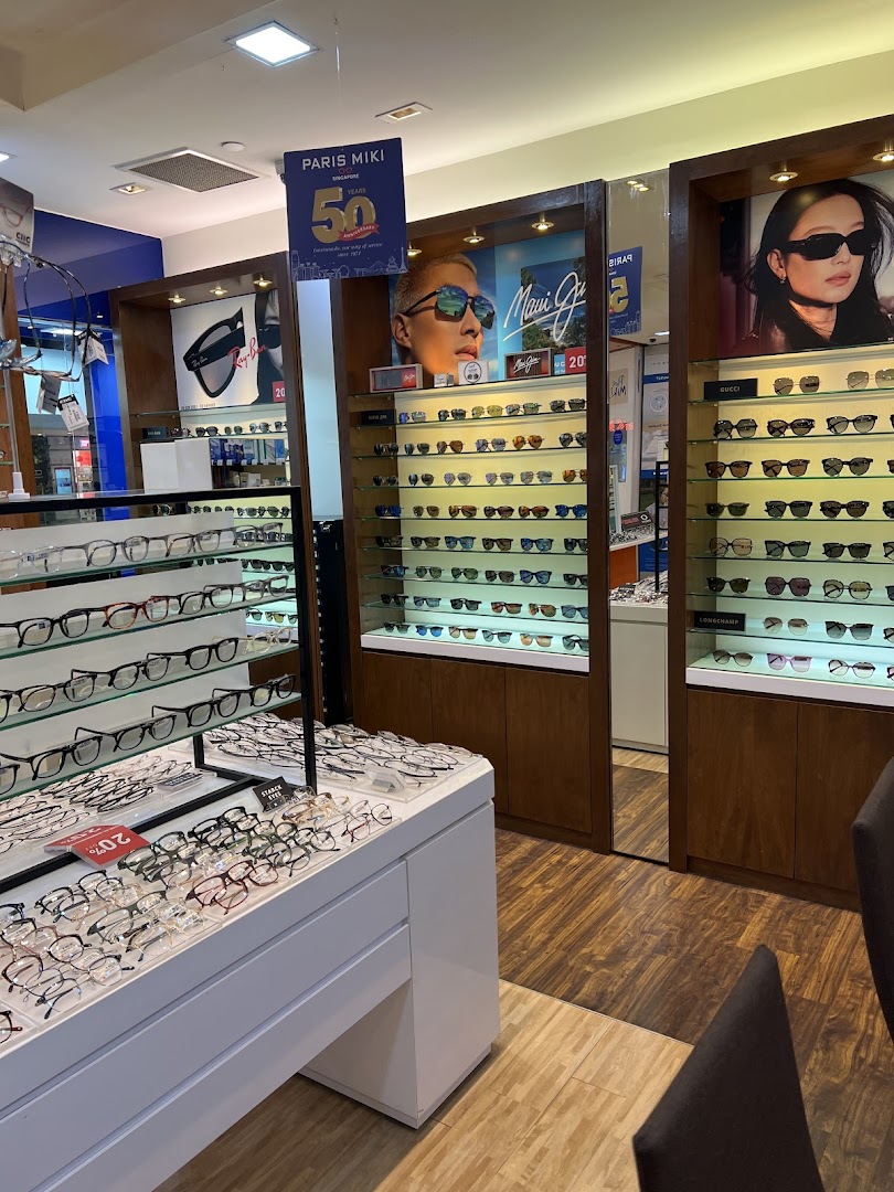 Interior view of Paris Miki optician, showcasing a wide selection of spectacles and sunglasses on display.