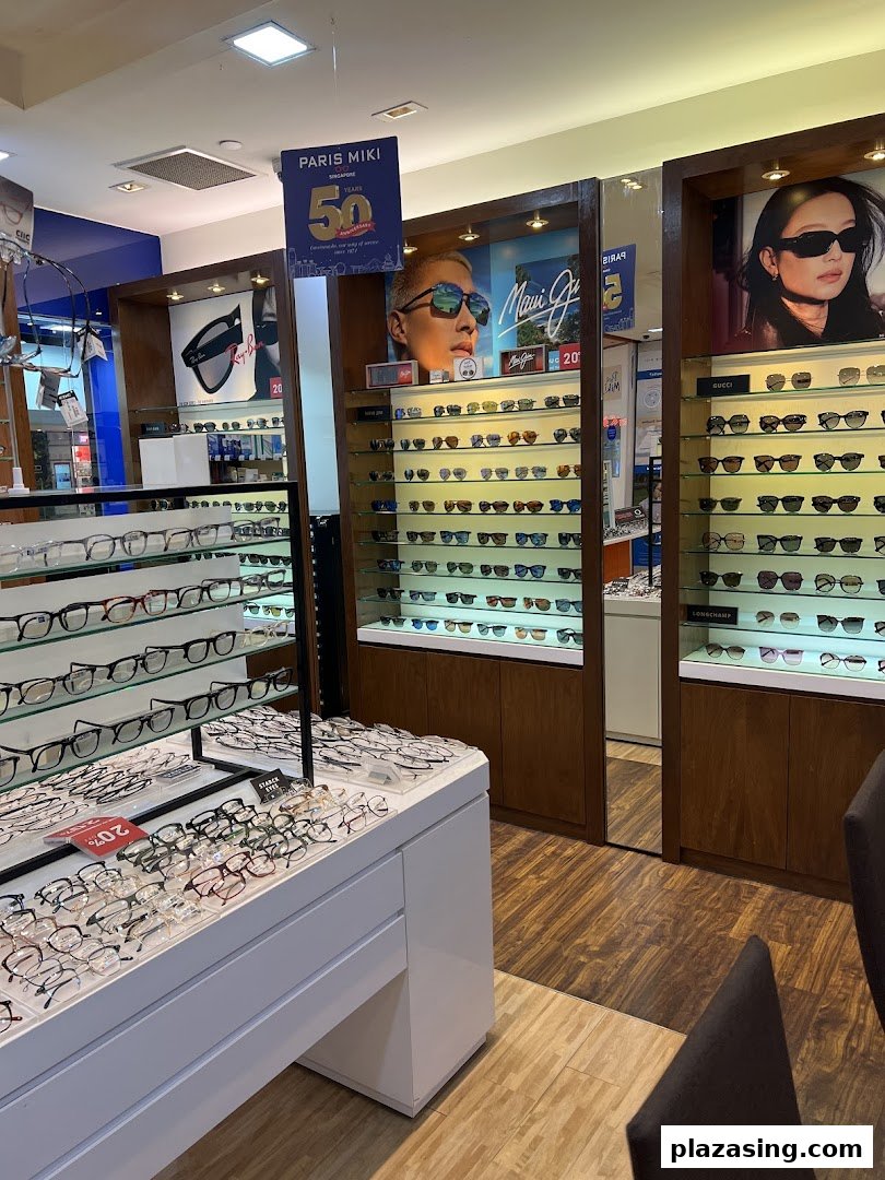 Interior view of Paris Miki optician, showcasing a wide selection of spectacles and sunglasses on display.