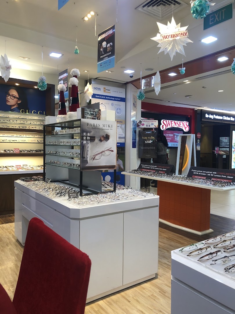 Interior view of Paris Miki optical shop, showcasing various spectacles, sunglasses, and eye care displays.