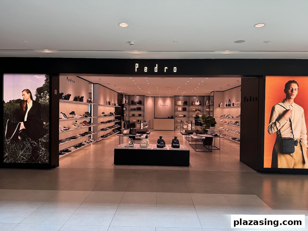 The inviting entrance of PEDRO showcasing a wide range of stylish shoes and accessories.