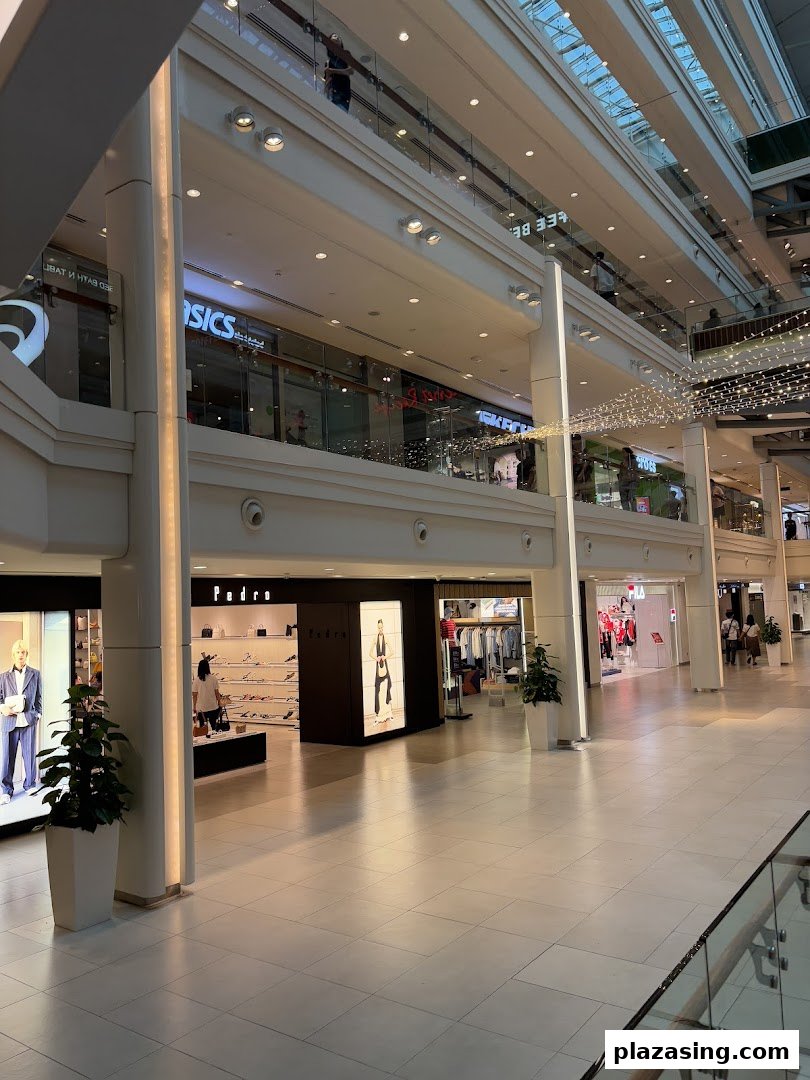 View of the PEDRO shop entrance and storefront within a brightly lit shopping mall.