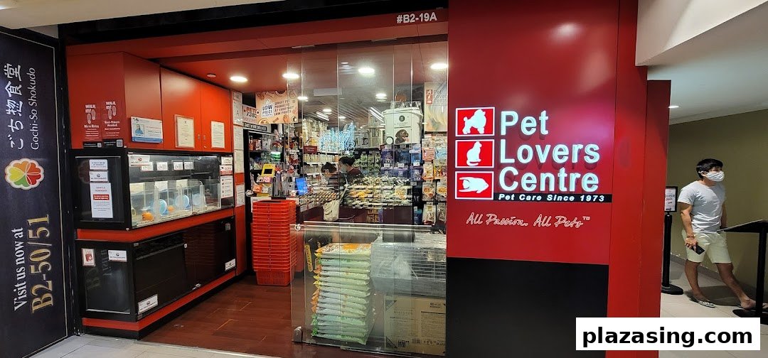 The vibrant red storefront of Pet Lovers Centre, a pet care shop, at Plaza Singapura.