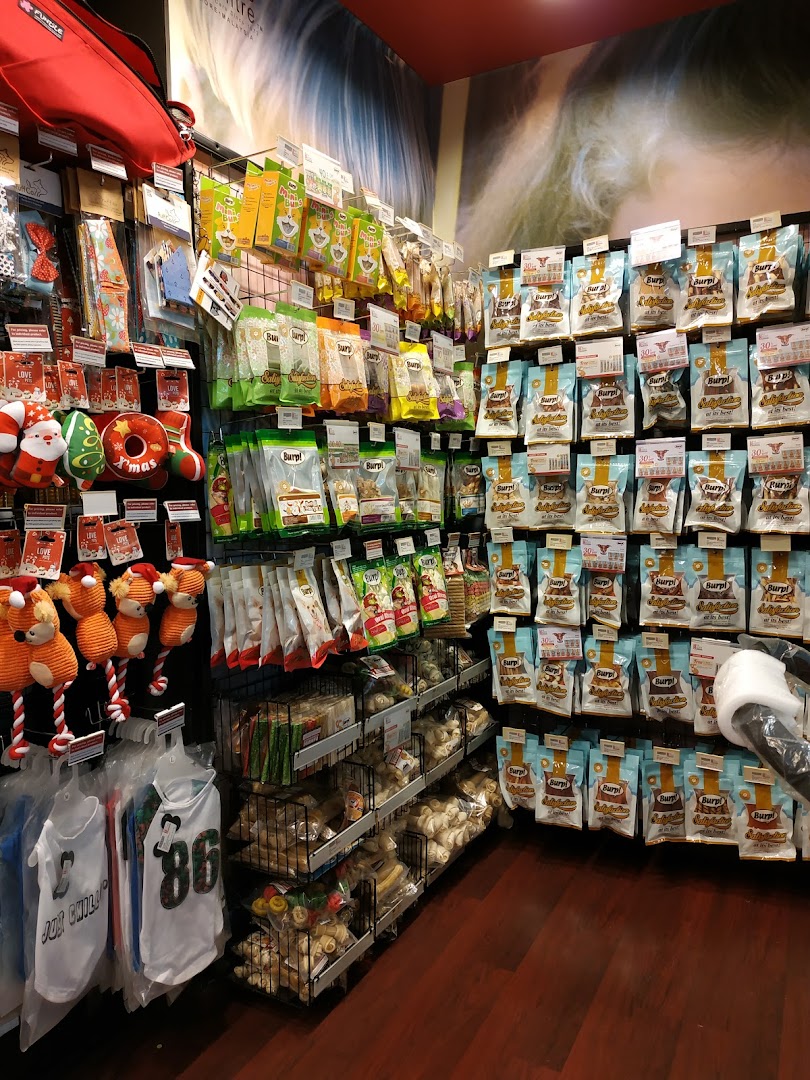 Interior view of Pet Lovers Centre, showcasing a wide array of pet food, treats, and accessories on display.
