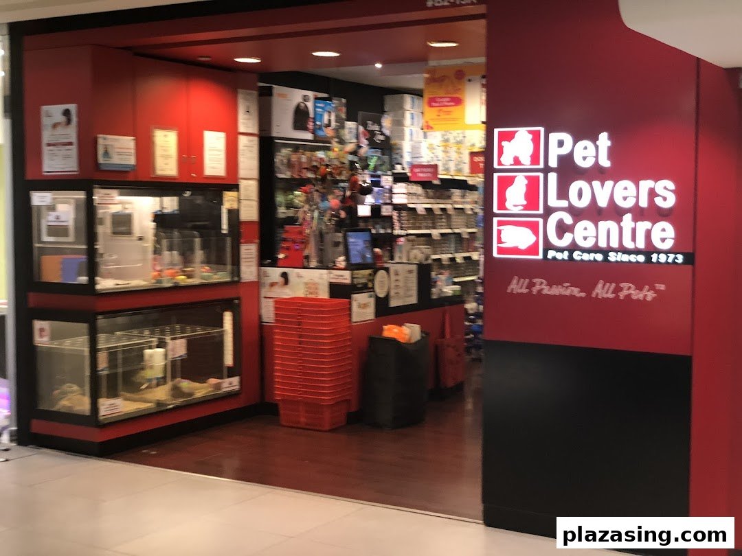 The vibrant red entrance of Pet Lovers Centre, showcasing pet enclosures and a wide array of pet products.