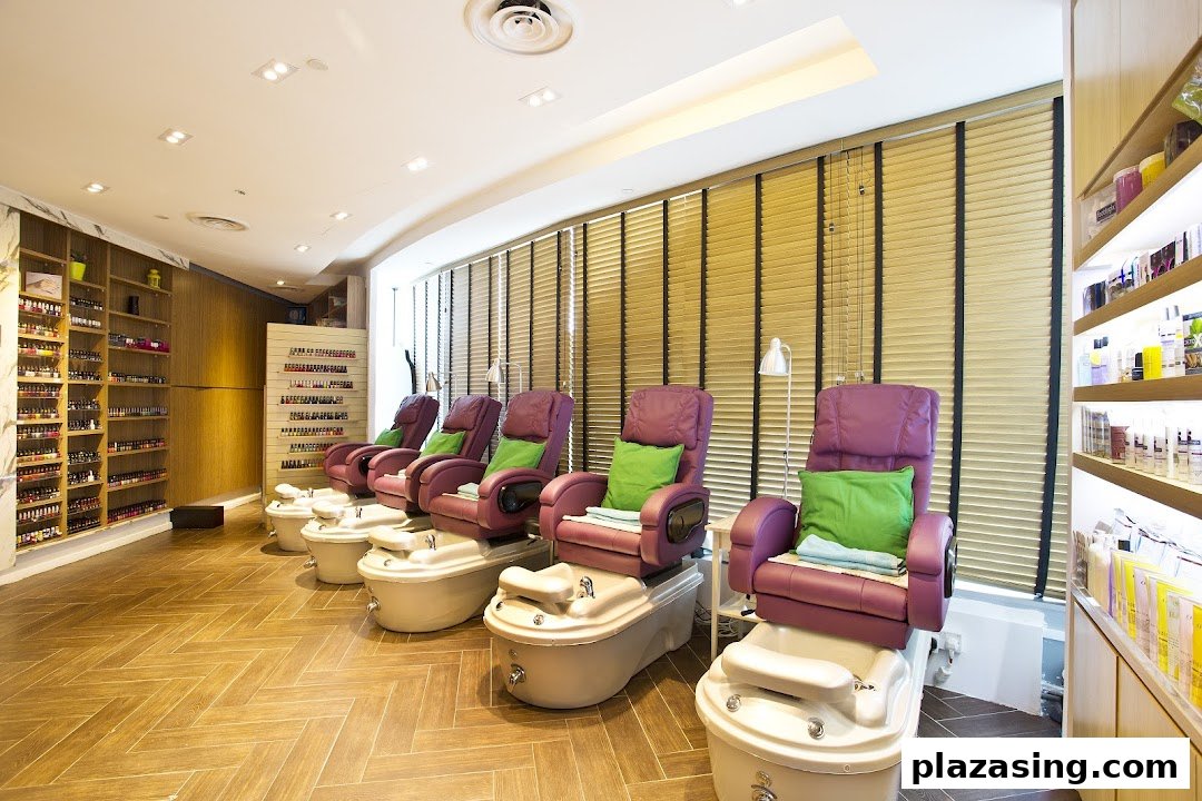 Interior view of a modern nail spa with multiple pedicure chairs and extensive nail polish displays.