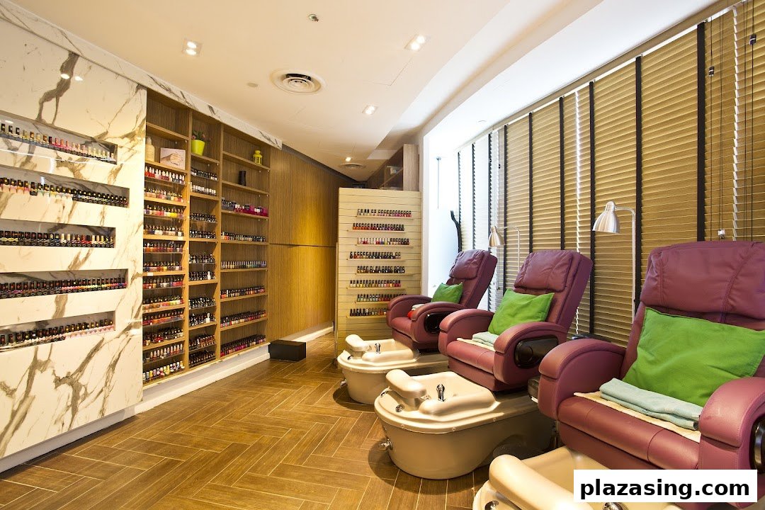 Interior view of Pixie Nail Spa featuring comfortable pedicure chairs and extensive nail polish displays.