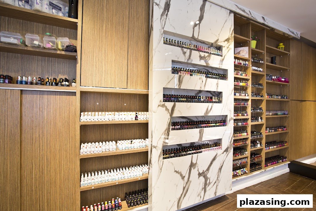 Interior view of Pixie Nail Spa showcasing extensive nail polish collections on stylish shelves.