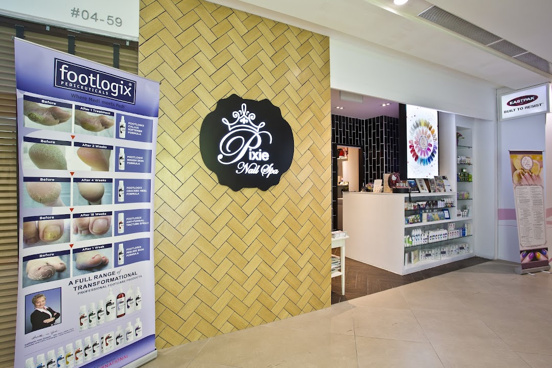 The inviting entrance of Pixie Nail Spa, featuring its logo, a Footlogix display, and a peek into the interior.