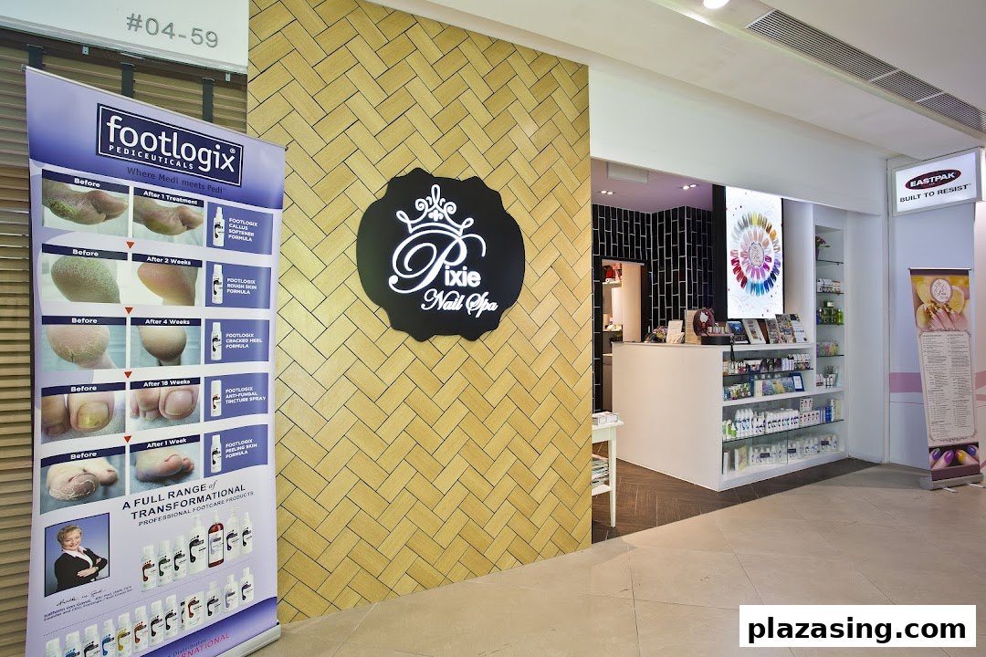 The inviting entrance of Pixie Nail Spa, featuring its logo, a Footlogix display, and a peek into the interior.