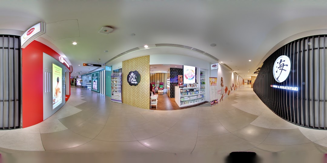 The inviting entrance of Pixie Nail Spa, showcasing its cozy interior and product displays.