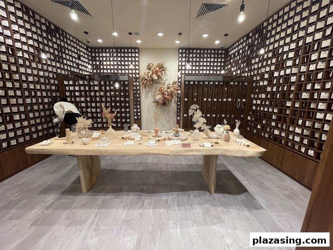 An interior view of Playdress Plaza Singapura, featuring a large wooden display table and walls filled with accessories.