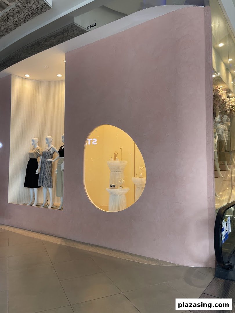The shop front of Playdress Plaza Singapura featuring mannequins and accessory displays.
