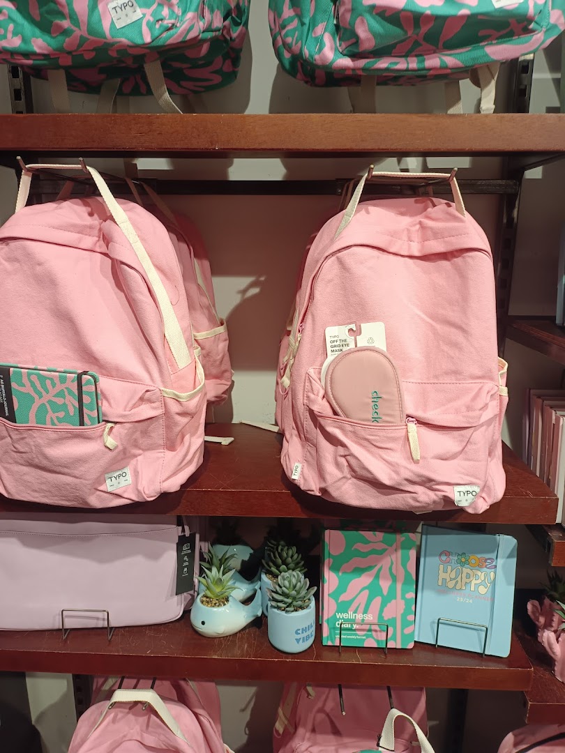 Pink backpacks, stationery, and decor items displayed on Typo shelves.