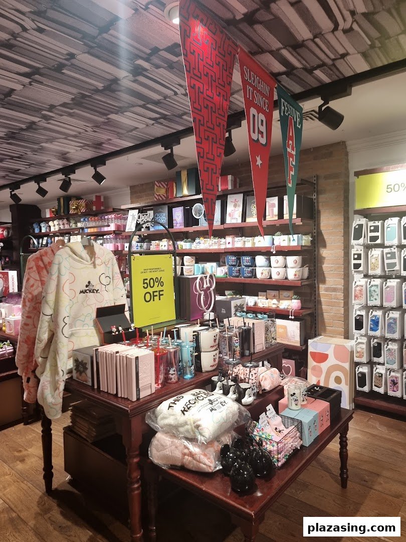 Interior view of Typo showcasing various stationery, gifts, and Mickey Mouse merchandise with a 50% off sale.