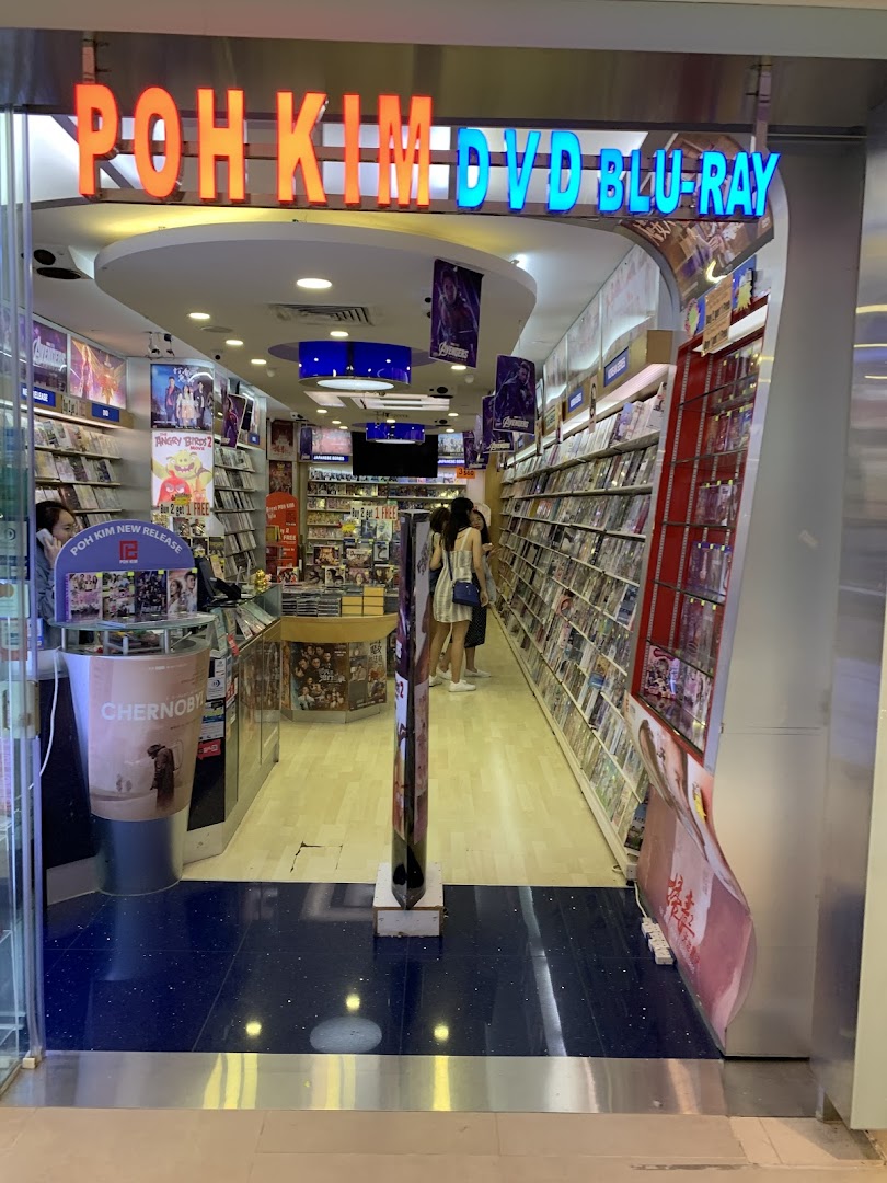The entrance of Poh Kim, a DVD and Blu-ray store, with shelves of media visible inside.