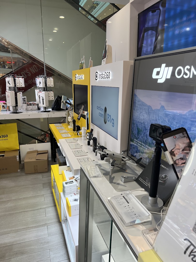 Interior view of Propeller Singapore, showcasing Insta360 cameras, DJI drones, and tech accessories on display.