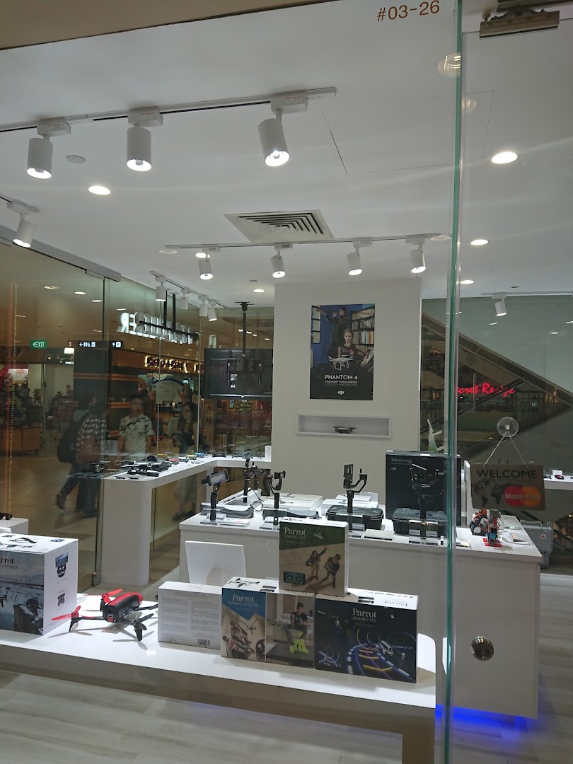 The shop front of Propeller Singapore showcasing drones, camera stabilizers, and tech gadgets on display.