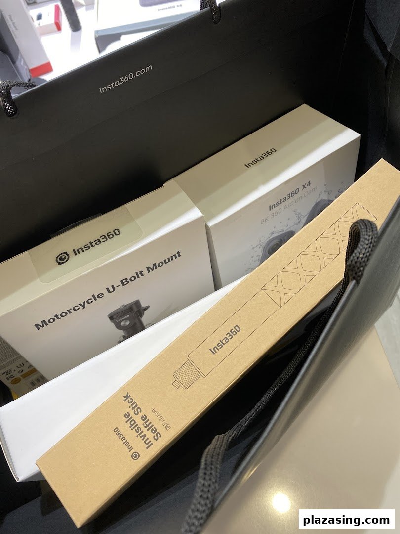 Insta360 action cameras and accessories, including an X4 8K camera and selfie stick, in a shopping bag.