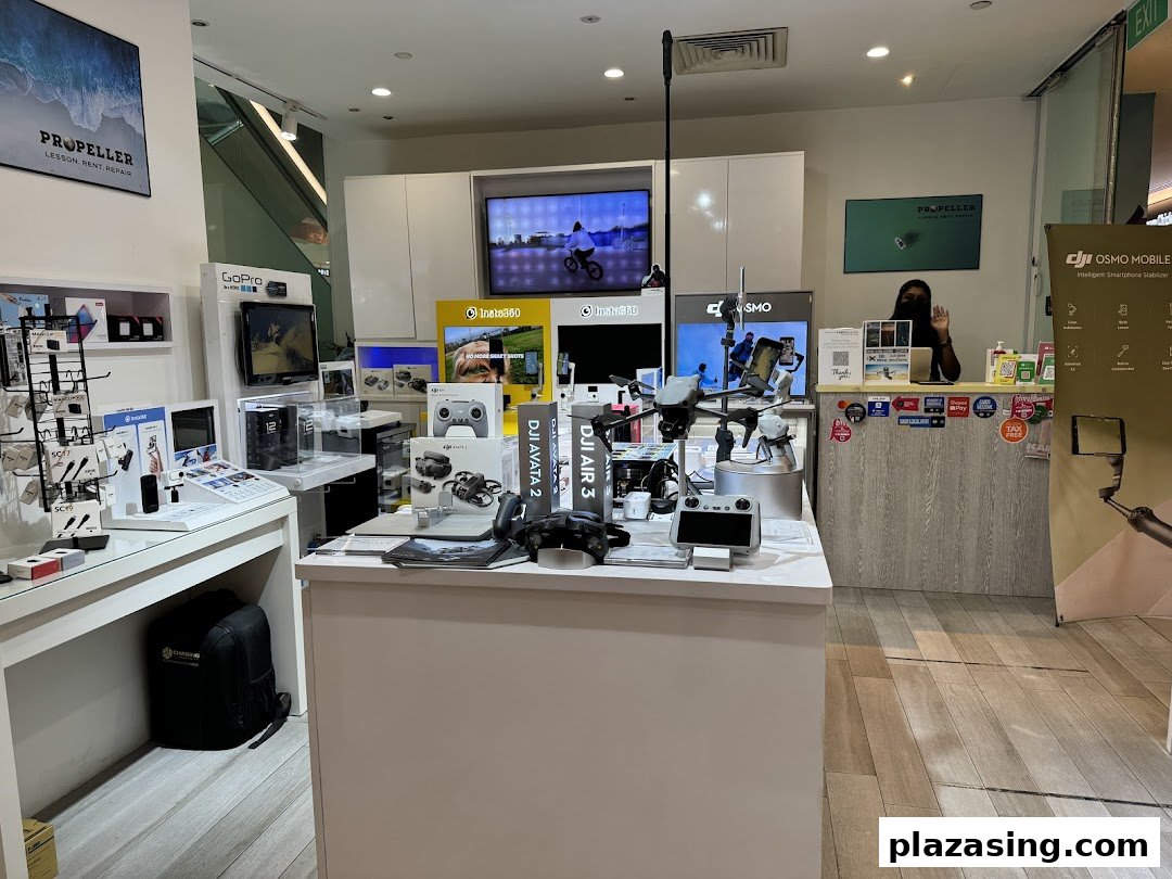 Interior view of Propeller Singapore, a tech shop featuring DJI drones, GoPro, Insta360 cameras, and accessories.