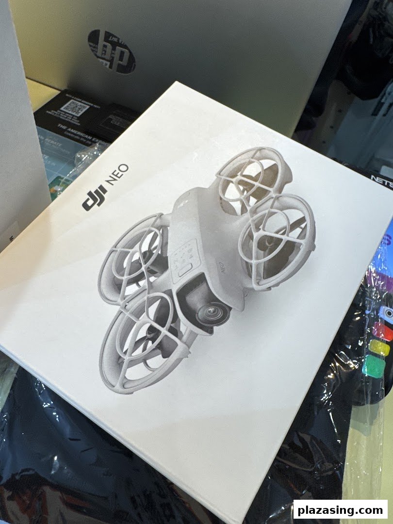 Close-up of a white product box featuring a DJI NEO drone, likely from a tech or gadget store.