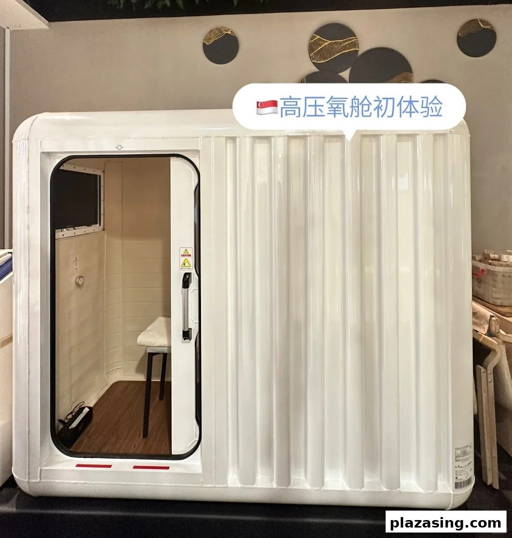 A white hyperbaric oxygen chamber with an open door, showing an interior seat.