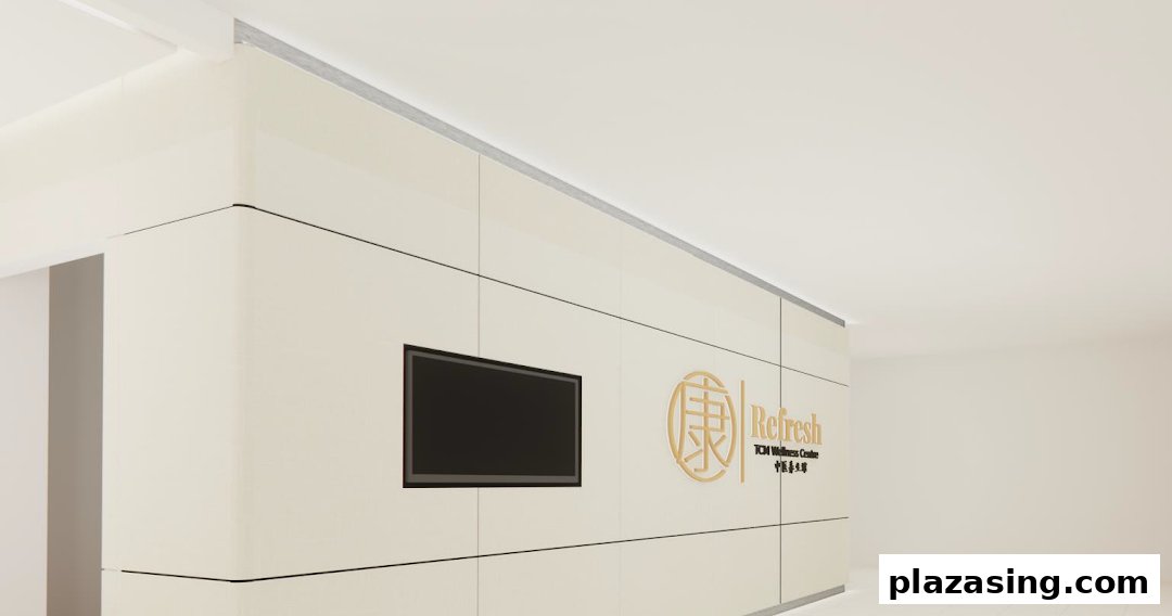 The image displays the clean, modern entrance of Refresh TCM Wellness with its golden logo and signage.