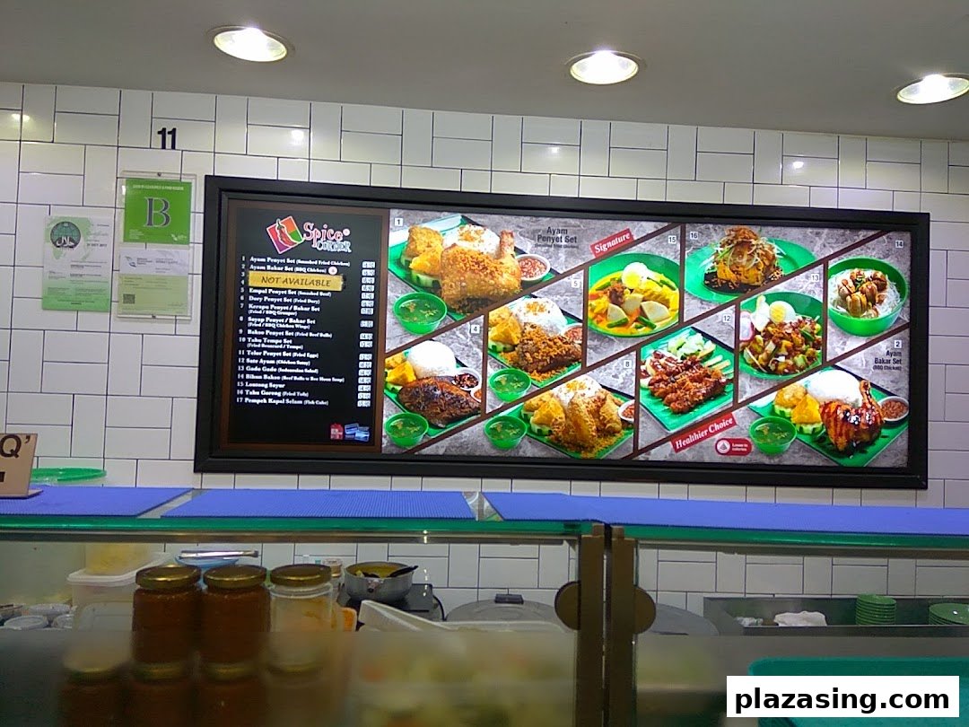 A vibrant digital menu board showcasing various Indonesian dishes with images and item names.