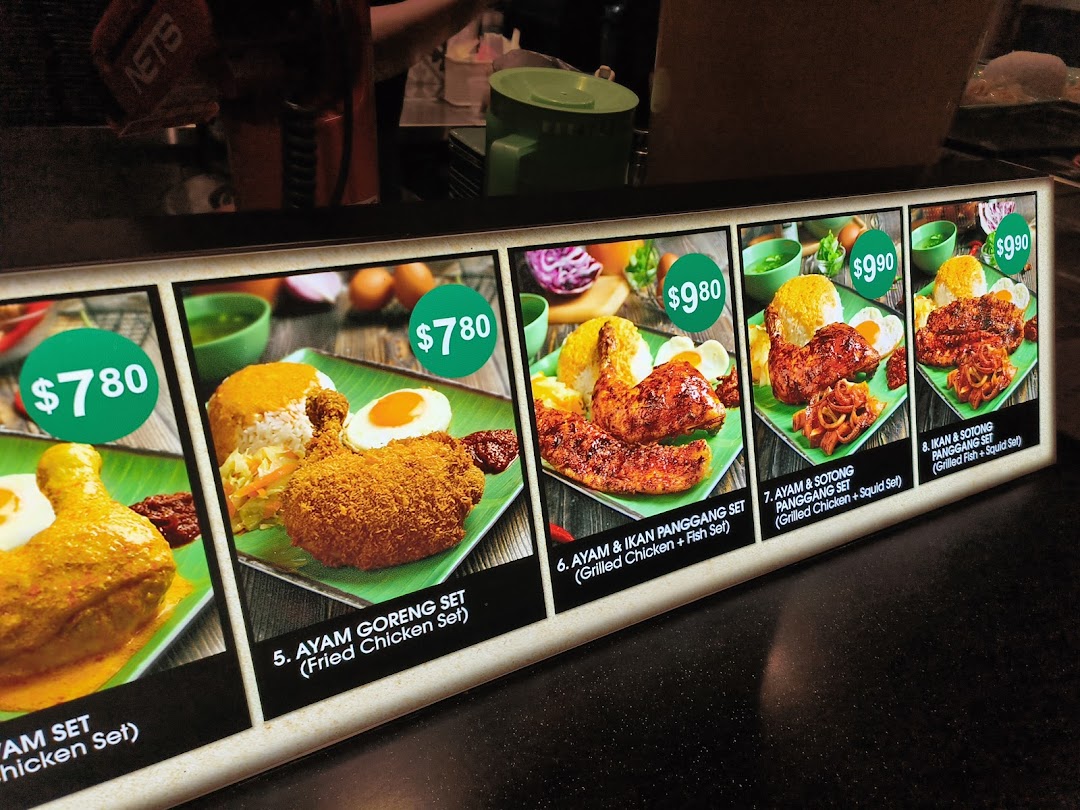 A display board showcasing various Indonesian BBQ chicken and fish sets with prices.