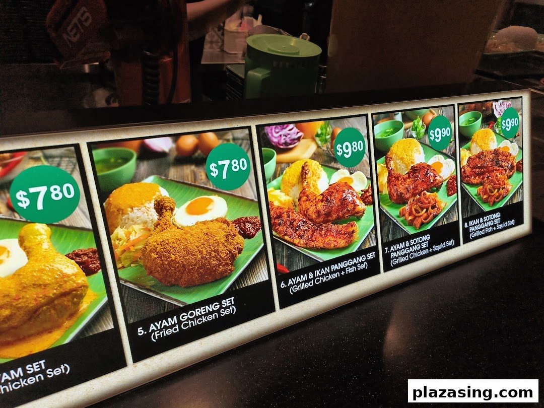 A display board showcasing various Indonesian BBQ chicken and fish sets with prices.