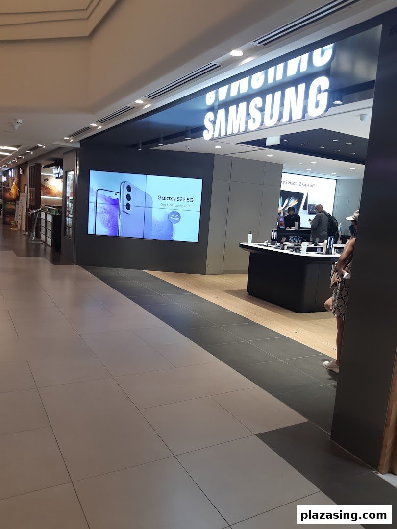The entrance of a Samsung Service Centre with a large display showing a Galaxy S22 5G promotion.