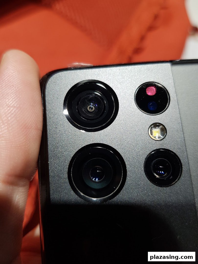Close-up view of a Samsung smartphone's multi-lens camera system and flash.
