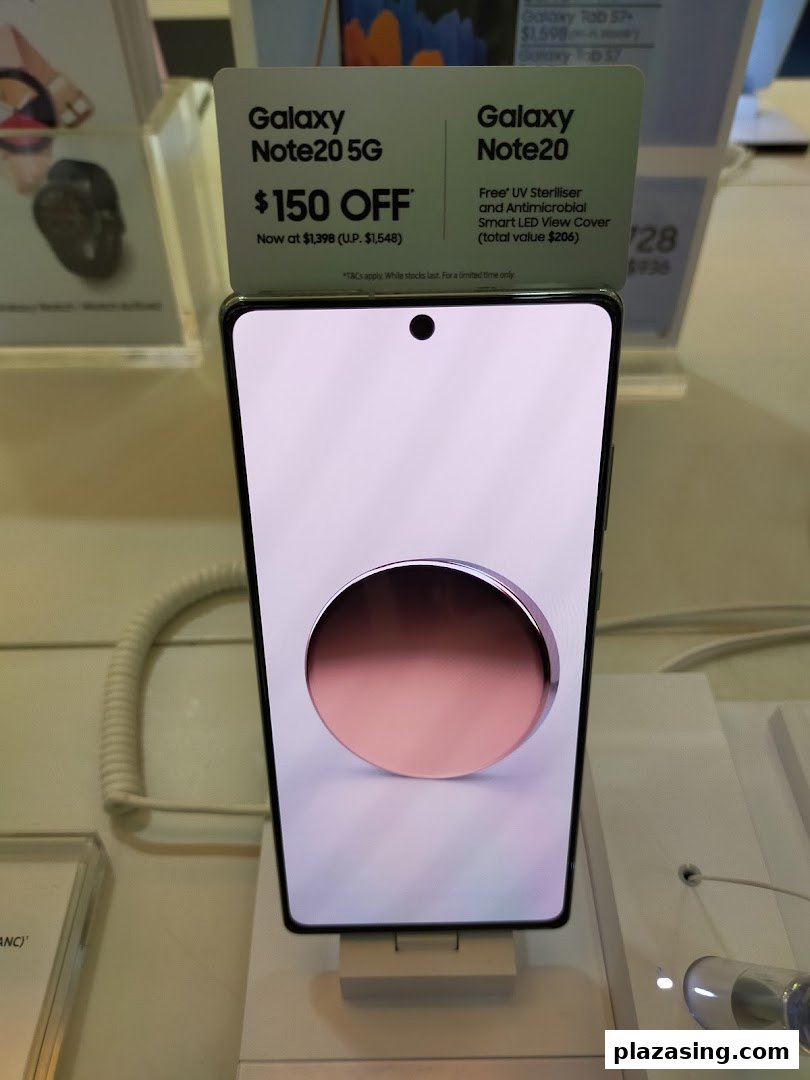 A Samsung Galaxy Note20 5G smartphone on display with promotional offers in a Samsung store.