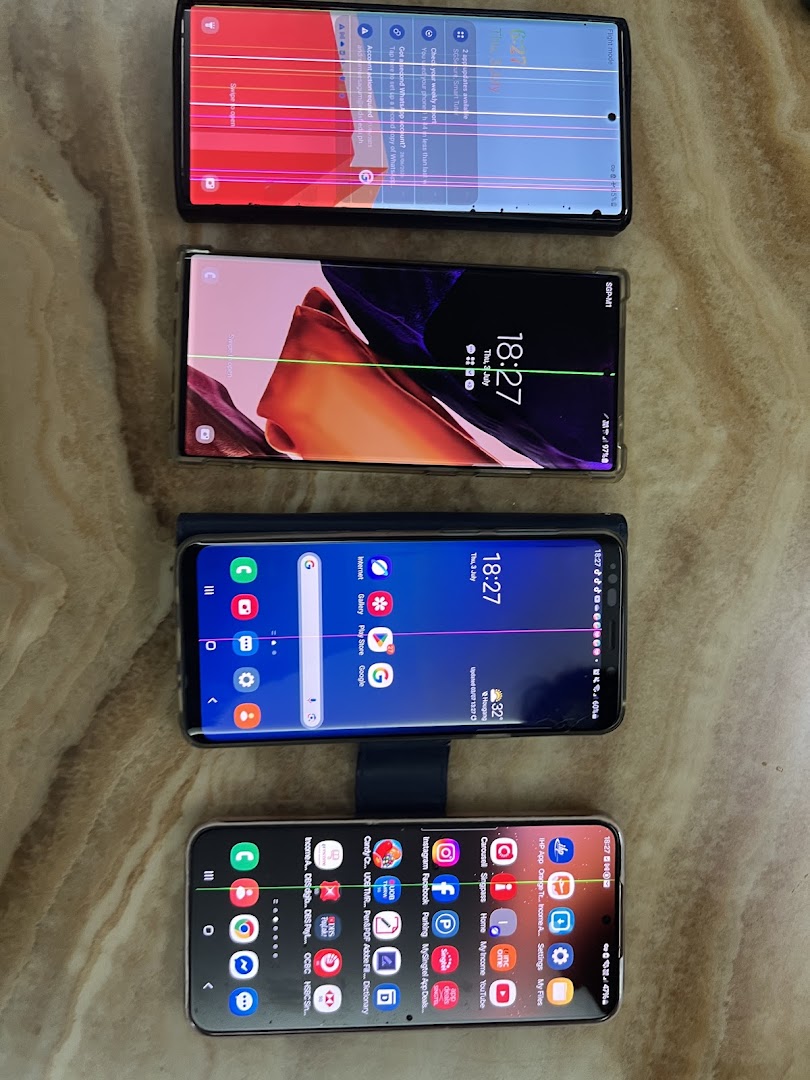 Four Samsung smartphones exhibiting various screen damage and display issues.