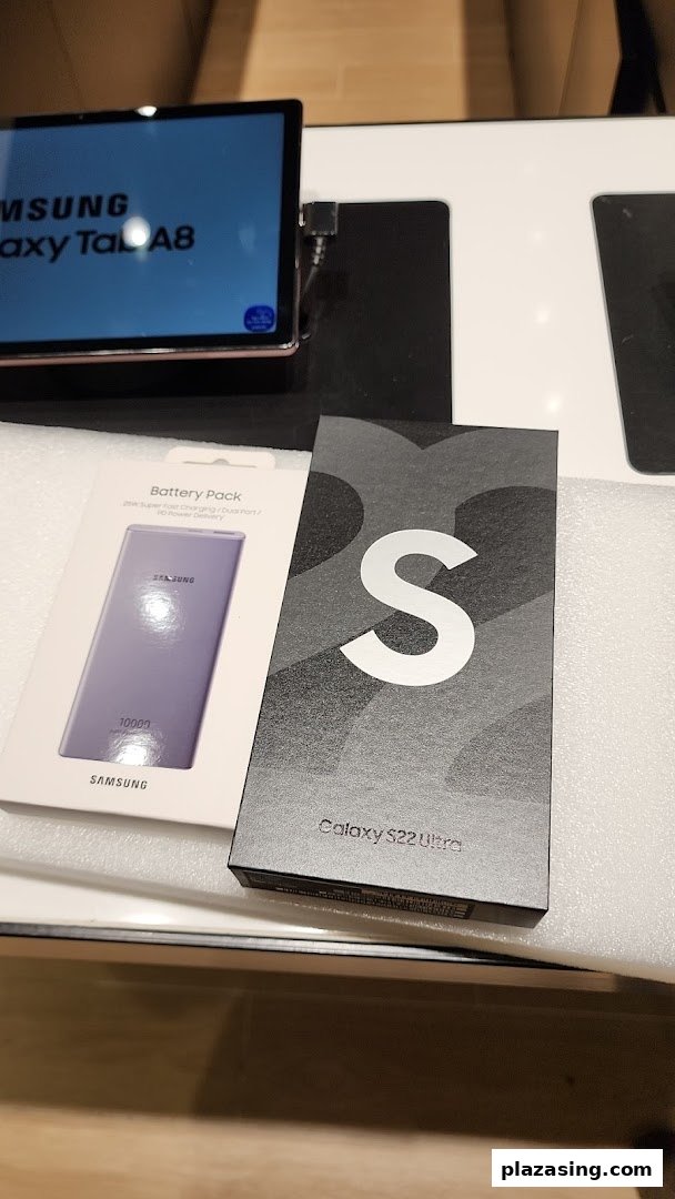 Samsung Galaxy Tab A8, Battery Pack, and S22 Ultra box displayed in a Samsung Service Centre.
