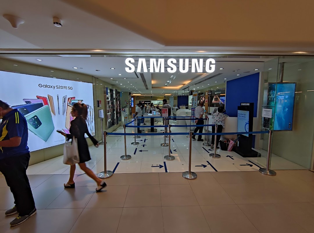 The entrance of a Samsung Service Centre, showcasing products and customer service areas.