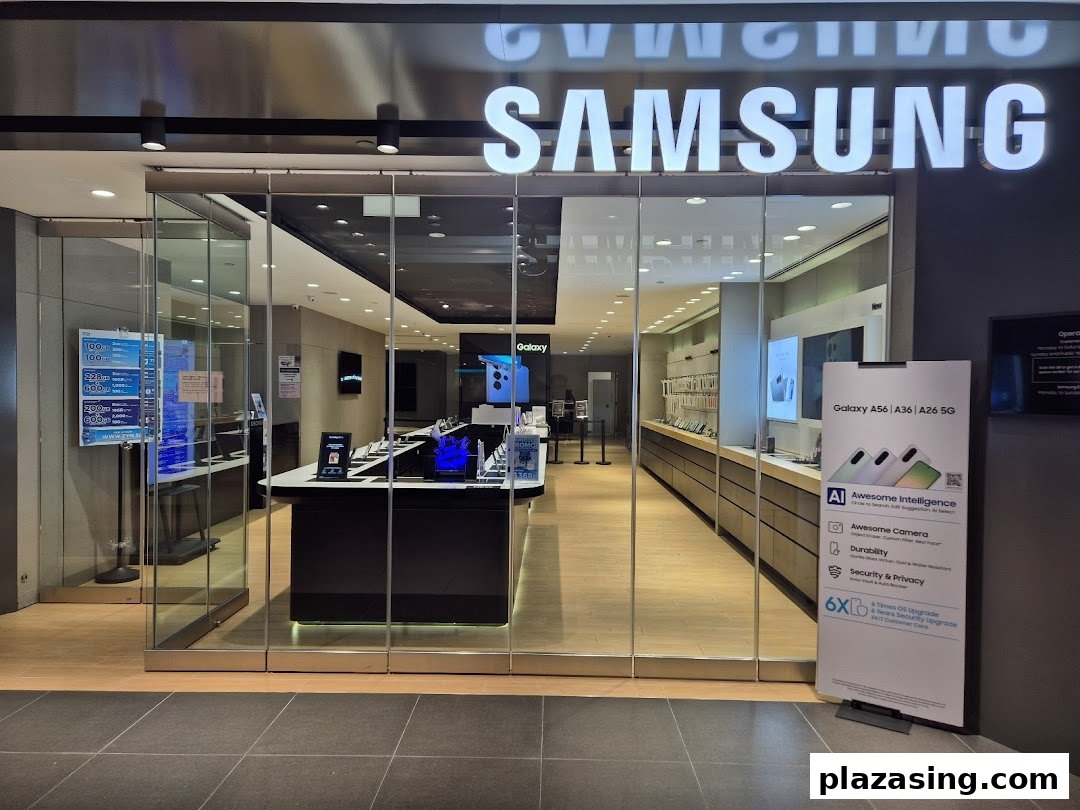 The illuminated entrance of a Samsung Service Centre showcasing various devices and service information.