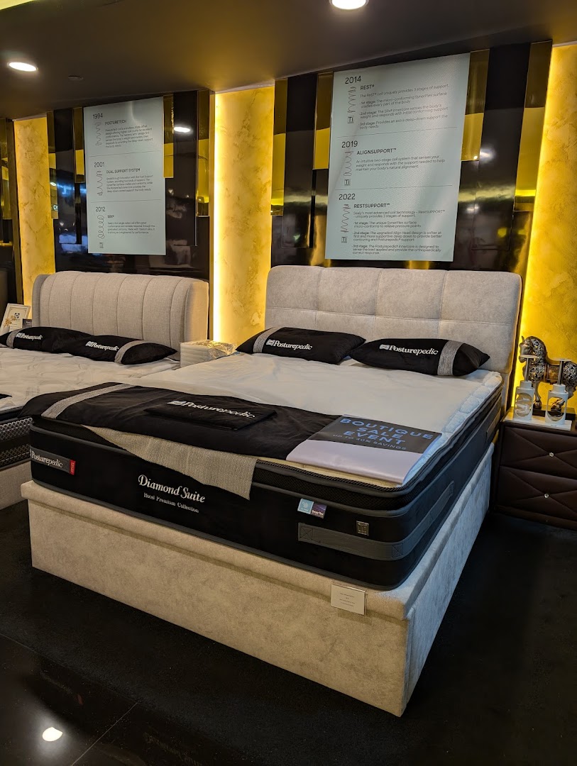 An interior view of Sealy Sleep Boutique showcasing premium mattresses and beds with informational displays.