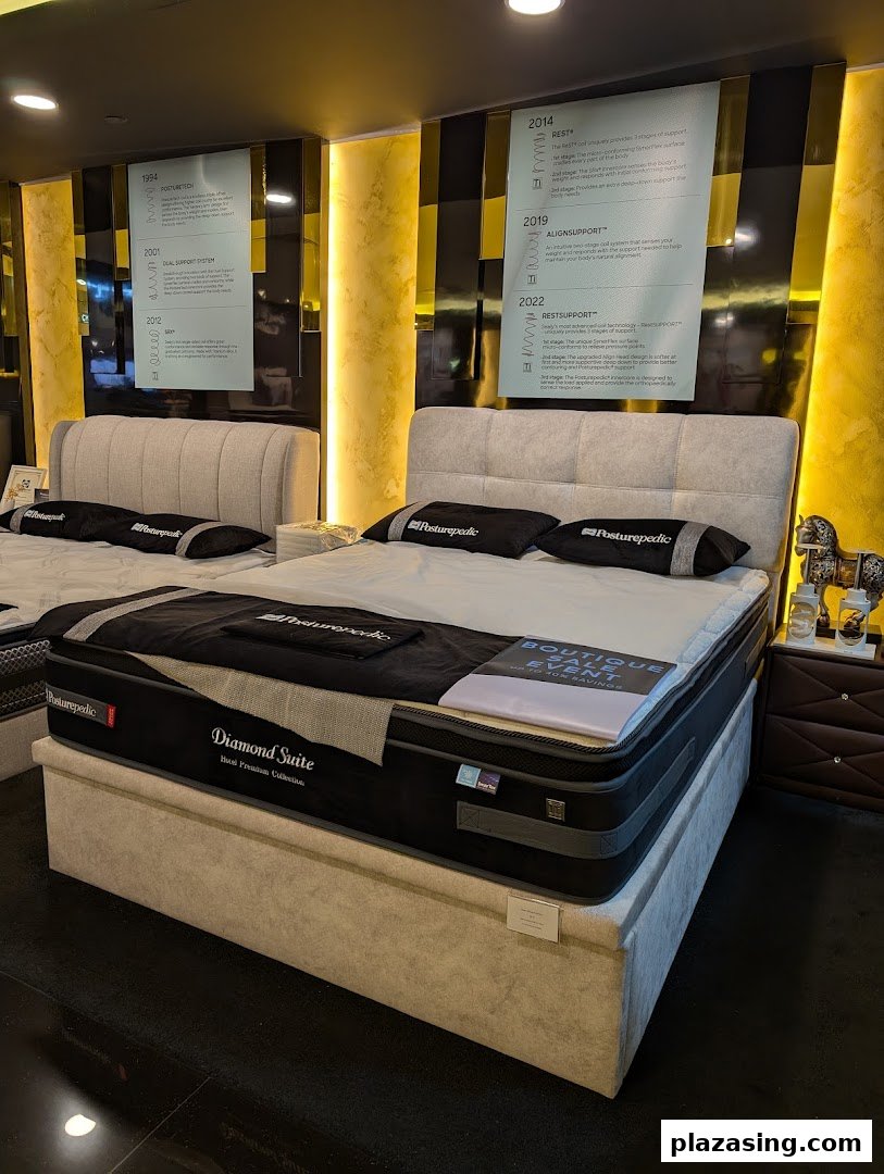 An interior view of Sealy Sleep Boutique showcasing premium mattresses and beds with informational displays.