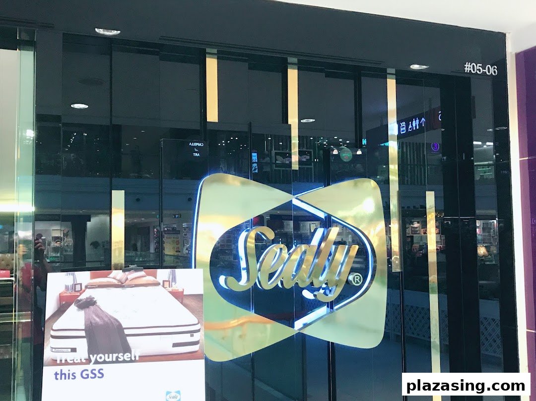 The entrance of Sealy Sleep Boutique with its prominent logo and a promotional sign for mattresses.