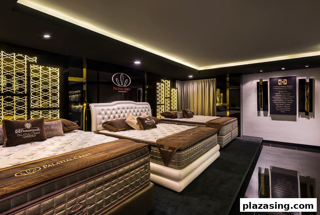 Interior view of a luxurious mattress showroom featuring multiple beds and elegant decor.
