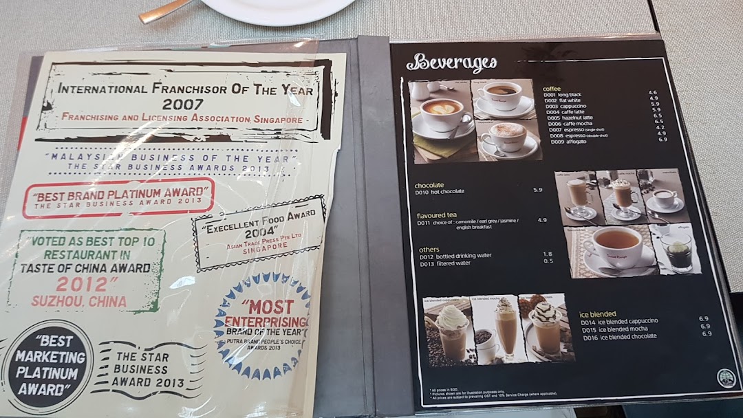 An open menu displaying Secret Recipe's beverage options and a page highlighting their numerous awards.