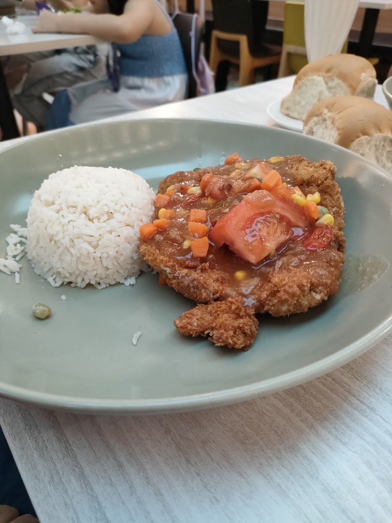 A plate of crispy breaded cutlet with savory sauce, rice, and mixed vegetables.